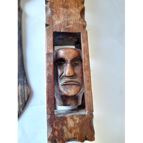 31 - 3 x Treen items to include long  3 x carved wood heads in cage from one piece of wood 47cm long alon... 
