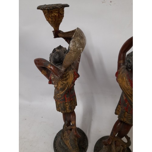 130 - Pair of Spelter Polychrome Candlesticks of male and female form, some damage to female as seen in ph... 