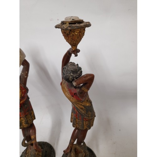 130 - Pair of Spelter Polychrome Candlesticks of male and female form, some damage to female as seen in ph... 