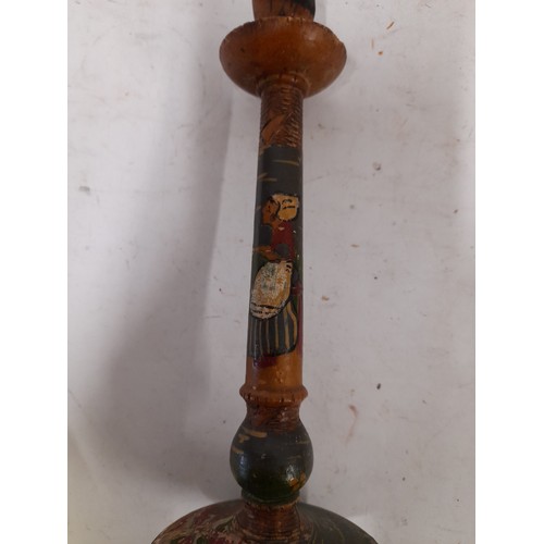 131 - Pair of Folk Art Wooden Candlesticks hand painted Dutch lady and carved decoration. 26cm high