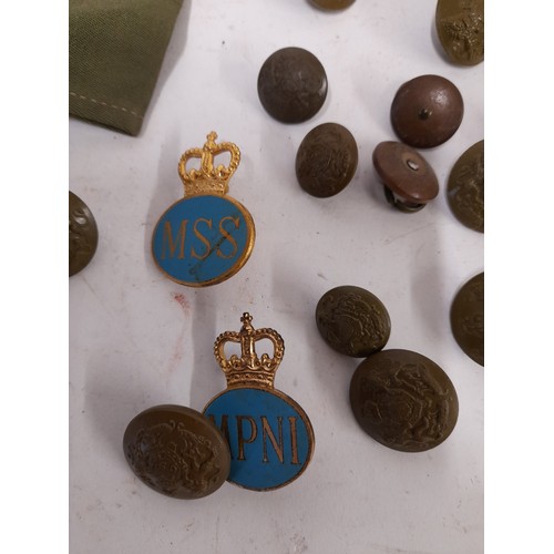 135 - Of Military interest, quantity of buttons, badges and a signed piece of uniform dated 1973