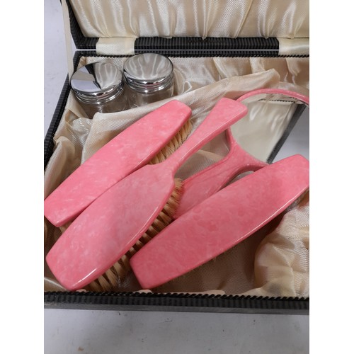 140 - Dressing table Brush Set and Mirror in Presentation case in Pink Marble effect Plastic /Bakelite