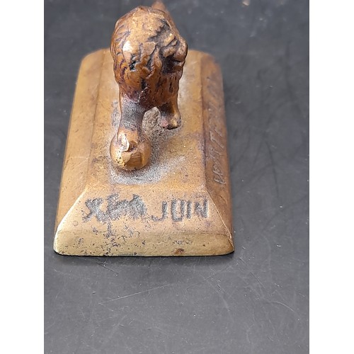 347 - Small Brass Lion on plynth4cm high x 5.5cm long with inscription to 3 sides