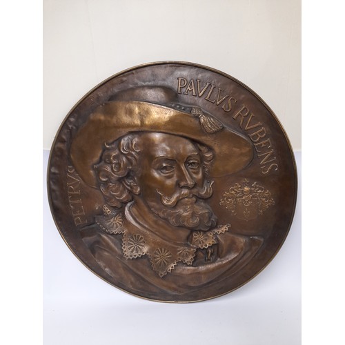 515 - Large Brass wall plaque of Rubens. 67cm dia