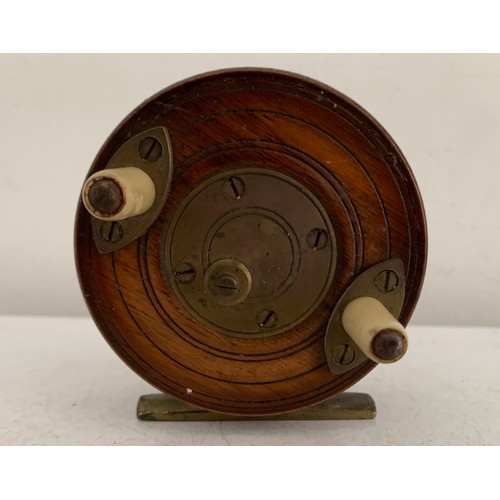 114 - Antique Wooden Starback Centre Pin Fishing Reel
8 cms diameter