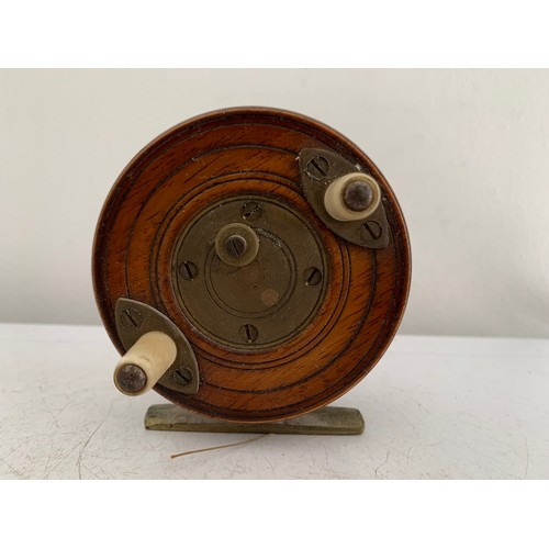 115 - Similar To Previous Lot
Antique Wooden Starback Centre Pin Fishing Reel
7.5 cms diameter