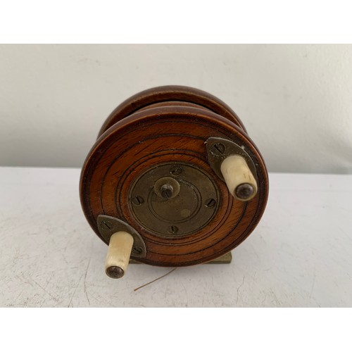 115 - Similar To Previous Lot
Antique Wooden Starback Centre Pin Fishing Reel
7.5 cms diameter