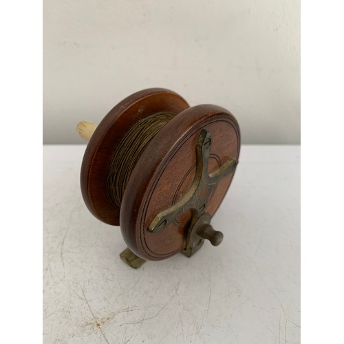 115 - Similar To Previous Lot
Antique Wooden Starback Centre Pin Fishing Reel
7.5 cms diameter