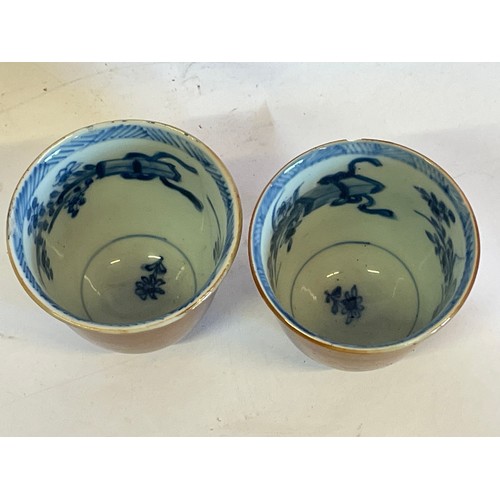 168 - Two Chinese Ceramic Cups With Internal Blue And White Decoration.