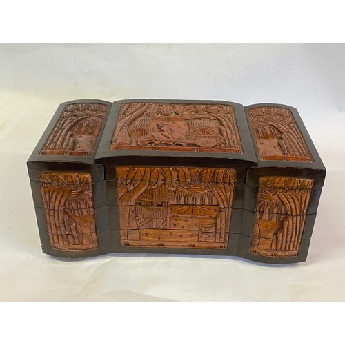 183 - Heavily Carved Oriental Style Jewellery Chest. 45 x 23 x 20 cms