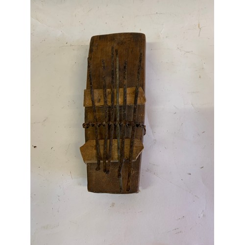 133 - Vintage Tribal Instrument Together With A Carved Tribal Mask
21 x 8 cms and mask 13 x 8 cms