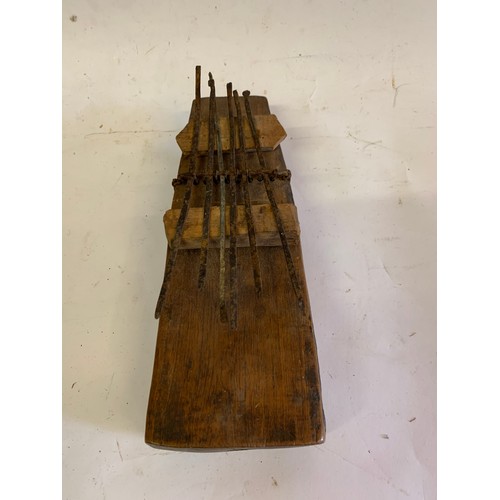 133 - Vintage Tribal Instrument Together With A Carved Tribal Mask
21 x 8 cms and mask 13 x 8 cms