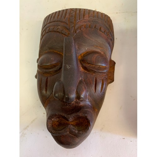 133 - Vintage Tribal Instrument Together With A Carved Tribal Mask
21 x 8 cms and mask 13 x 8 cms