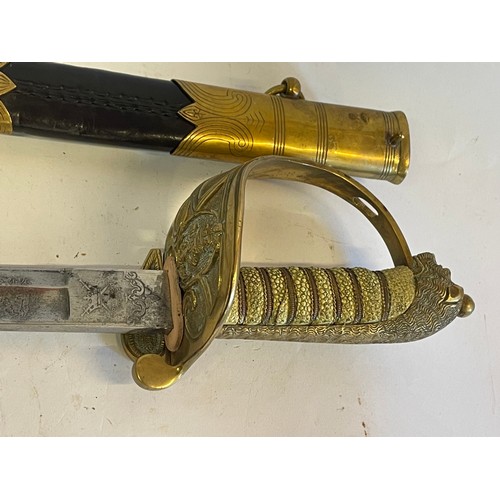 288 - Navel Officers Sword And Leather Scabbard, The Sword With Makers Name Crown Swords England Stamped T... 