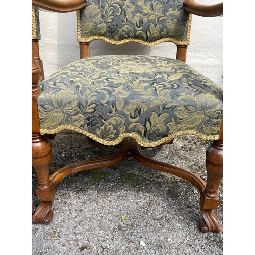 27 - Two Upholstered Carolean Style Walnut Elbow Chairs