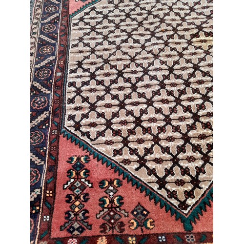 75 - Handmade Ground Rug with central design, 142cm x 105cm