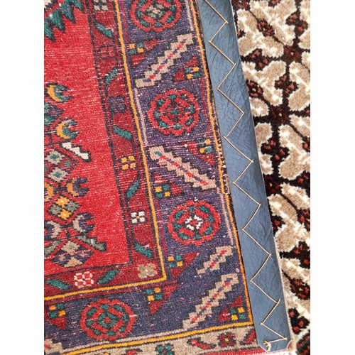 75 - Handmade Ground Rug with central design, 142cm x 105cm