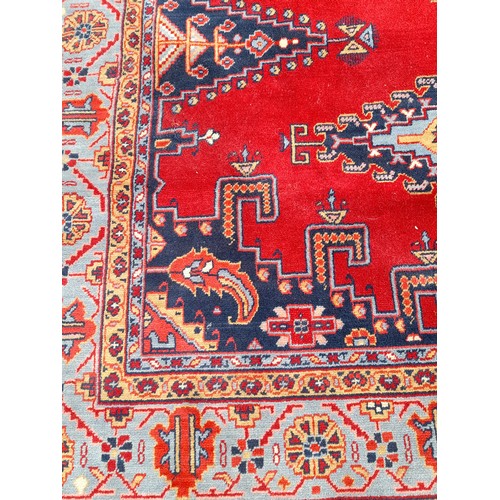 76 - Red Ground Kadjar Rug with central Lozenge 291cm x 198cm