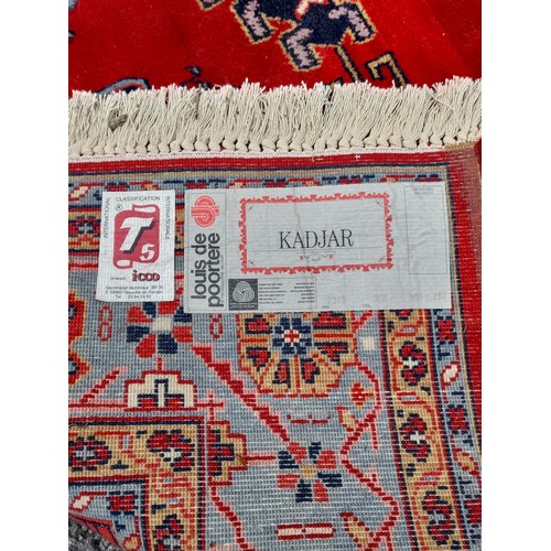 76 - Red Ground Kadjar Rug with central Lozenge 291cm x 198cm