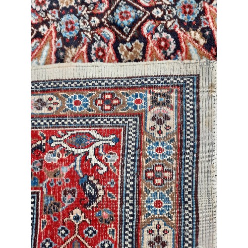 81 - Large Blue and Red Ground Rug, 310cm x 217