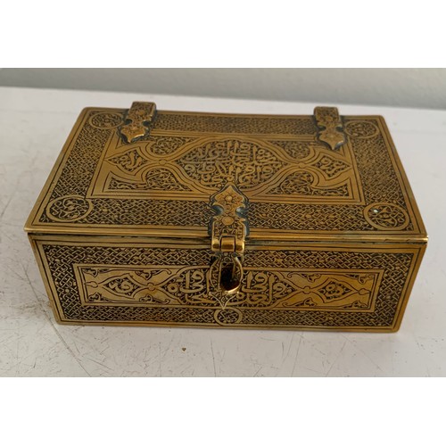 142 - Antique Brass Box In The Form Of A Lidded And Banded Trunk Having Islamic Etched Decoration
11 x 7 x... 