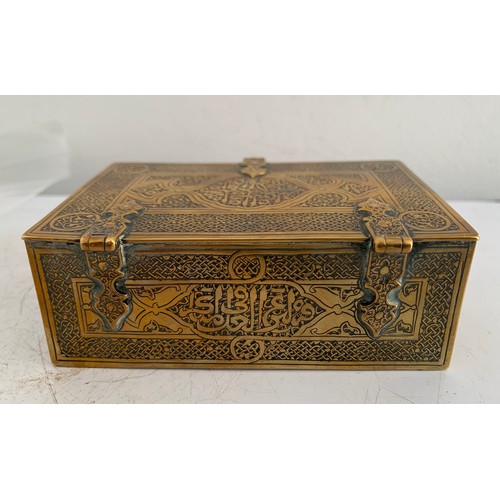 142 - Antique Brass Box In The Form Of A Lidded And Banded Trunk Having Islamic Etched Decoration
11 x 7 x... 