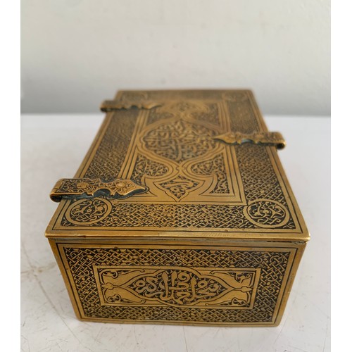 142 - Antique Brass Box In The Form Of A Lidded And Banded Trunk Having Islamic Etched Decoration
11 x 7 x... 