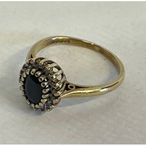 343 - 9ct Gold Hallmarked  Ring With Diamonds And A Central Blue Stone Size L. 2.3g