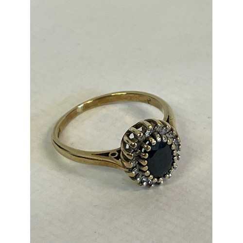 343 - 9ct Gold Hallmarked  Ring With Diamonds And A Central Blue Stone Size L. 2.3g