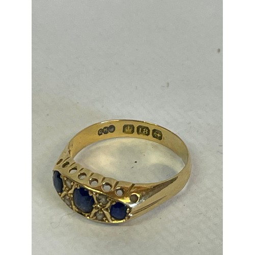 344 - 18ct Gold Hallmarked Diamond And Three  Sapphire Stone  Ring Size P      2.9g