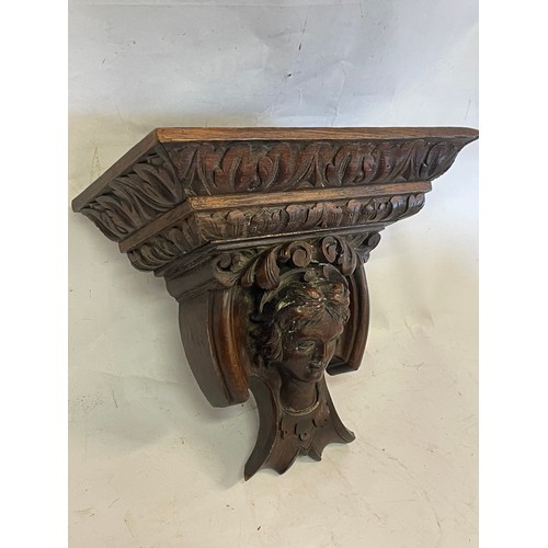 379 - 19th Century Carved Wood  Wall Bracket With A Carved Head Central Figure. 31 x 15 x 28 cms