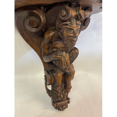 380 - 18th Century Carved Wood Bracket With A Carved Wood Figure Of A Faun.44 x 24 x 44 cms