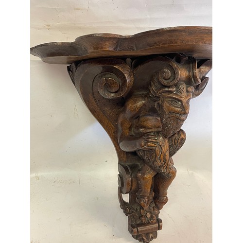 380 - 18th Century Carved Wood Bracket With A Carved Wood Figure Of A Faun.44 x 24 x 44 cms