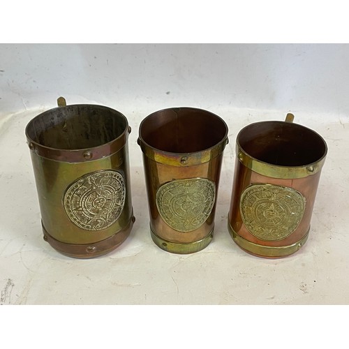 420 - Three Mexican Copper And Brass Mugs And A Beaker All With A Aztec Style Motif To The Front (3)