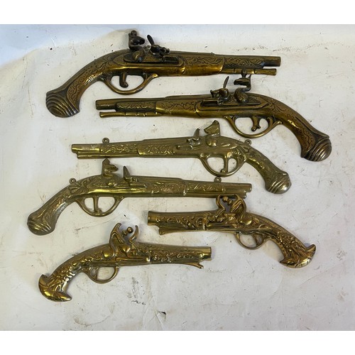 468 - Three Pairs Of Vintage Brass Wall Hanging Pistols. (6)