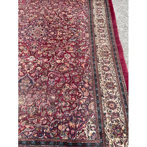 91 - Large Decorative Ground Hand Made Rug. 300 x 203 cms