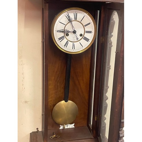 86 - Vintage Cased Two Hole Wall Clock With Key And Pendulum. 114 x 36 x 20 cms