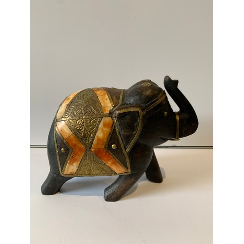 109 - Vintage Wooden Model Of An Éléphant Having Métal Inserts 
23 x 11 x 19 cms h