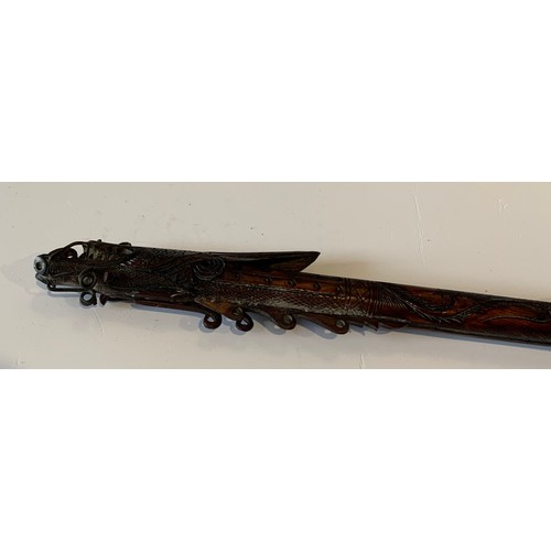 115 - Vintage Indonesian Carved Bone Blowpipe Depicting A Mythical Dragon Like Beast
77 cms in length