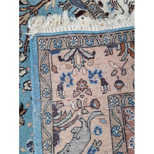 80 - Handmade Blue ground Rug with Stylised Tree of Life motif to centre. 205cm x 147cm