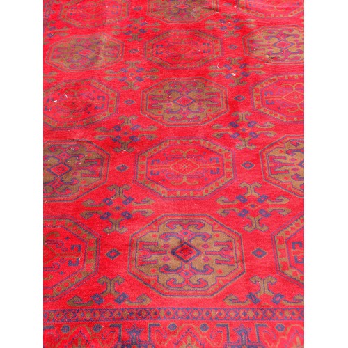 83 - Large Red ground Rug. 290cm x 198cm