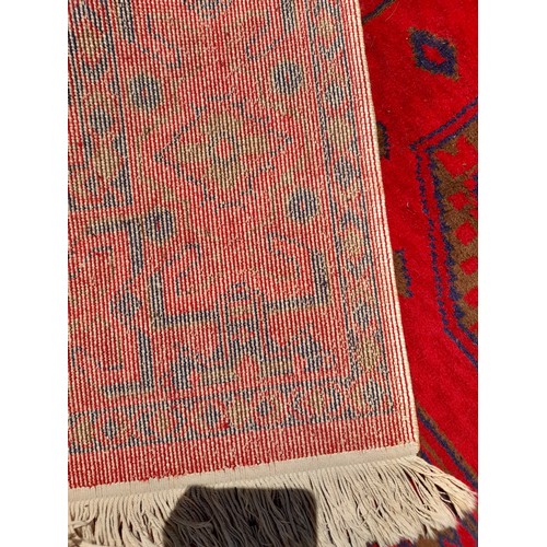 83 - Large Red ground Rug. 290cm x 198cm