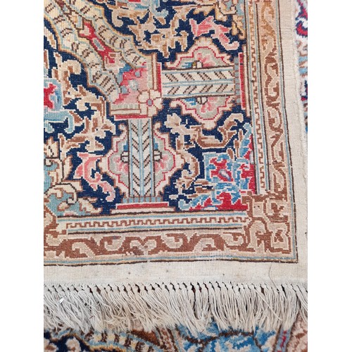 89 - Large Handmade Cream Ground Rug with Central Motif, 340cm x 222cm