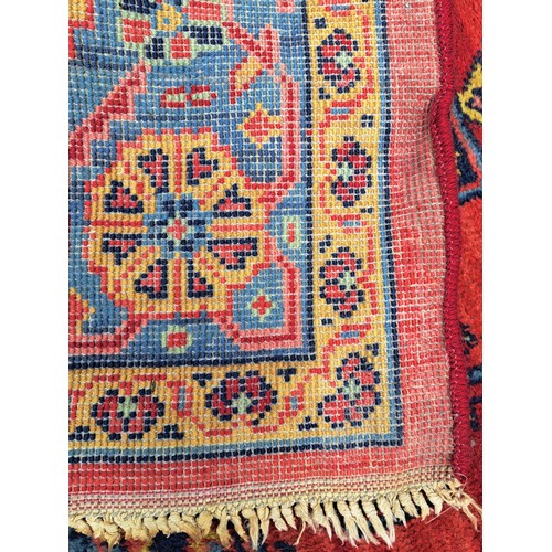 87 - Handmade Red Ground Rug with Blue Ground Central Motif, 250cm x 184cm