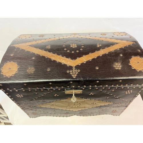 46 - A Leather And Studwork / Metalwork  Domed Top Trunk. 77 x 40 x 54 cms