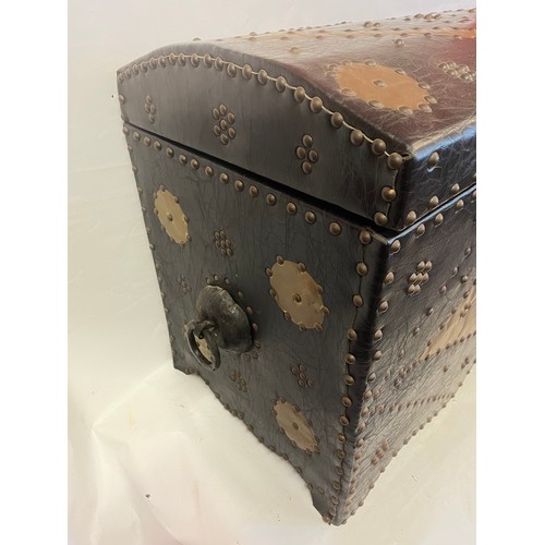 46 - A Leather And Studwork / Metalwork  Domed Top Trunk. 77 x 40 x 54 cms