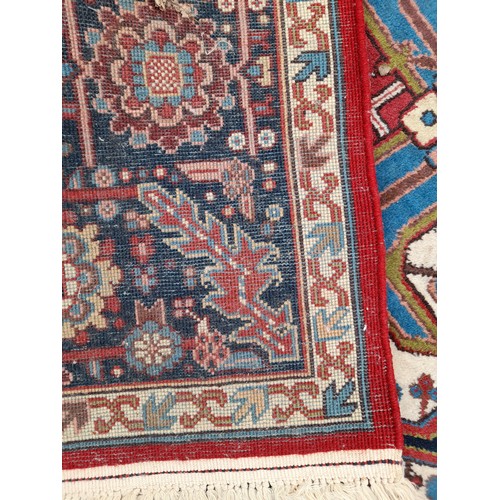 92 - Large Red Ground Rug with Blue Central Motif, 365cm x 252cm