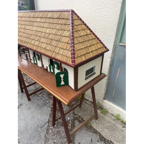 447 - Large Continental Scratch Built Wood Stable Block Model With Thatched Roof And Base Including Trestl... 