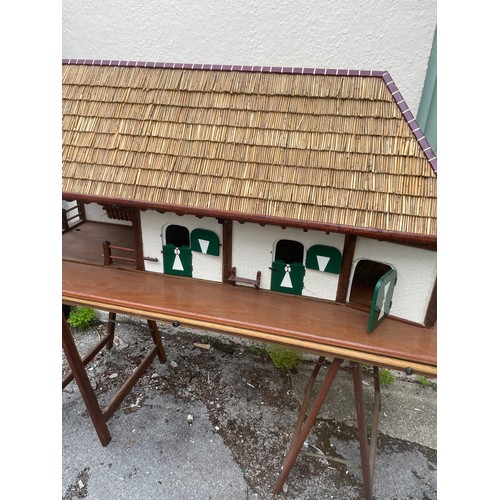 447 - Large Continental Scratch Built Wood Stable Block Model With Thatched Roof And Base Including Trestl... 