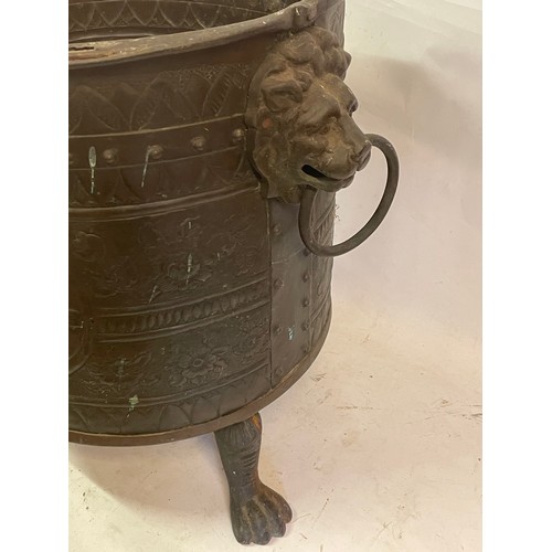 63 - Antique Copper Log Bucket With Lion Paw Feet And Lion Head Handles With Embossed Decoration. 44 x 39... 